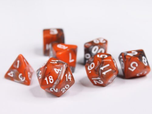 Collection of seven acrylic dice with swirled pearly silver and orange colouring and white numbers