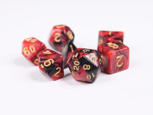 Collection of seven acrylic dice with swirled pearly black and red colouring and gold numbers