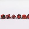 Brutal Barbarian Poly-Dice Set containing seven different dice: a D20, D100, D12, D10, D8, D6 and a D4