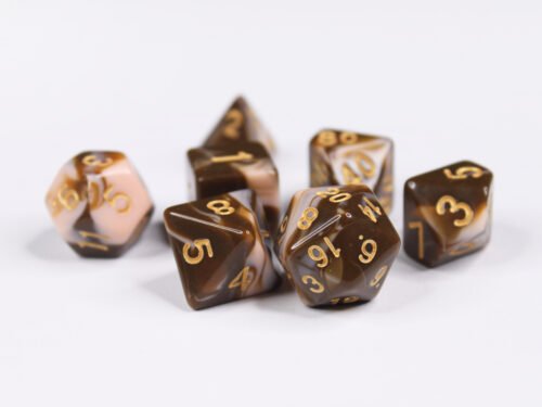 Collection of seven acrylic dice with swirled brown and cream colouring and gold numbers