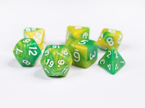 Collection of seven acrylic dice with swirled green and yellow colouring and white numbers