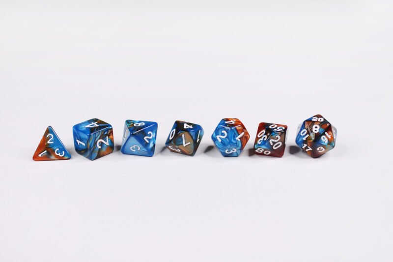 Goldfish Siren Poly-Dice Set containing seven different dice: a D20, D100, D12, D10, D8, D6 and a D4
