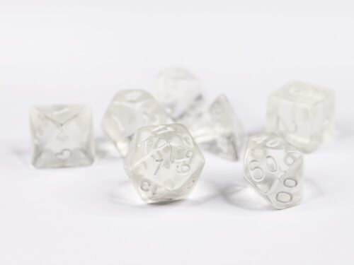 Collection of seven acrylic dice with of clear colouring and white numbers giving them an invisible illusion