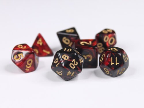 Collection of seven acrylic dice with swirled pearly black and red colouring and gold numbers