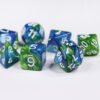 Collection of seven acrylic dice with swirled pearly blue and green colouring and white numbers