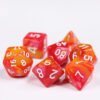 Collection of seven acrylic dice with swirled pearly red and orange colouring and white numbers