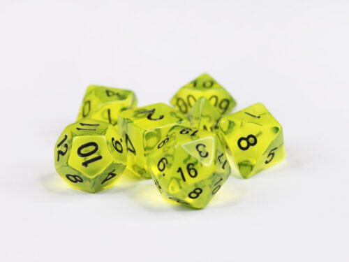 Collection of seven acrylic dice with clear neon green yellow colouring and black numbers