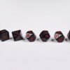 Vampire Bite Poly-Dice Set containing seven different dice: a D20, D100, D12, D10, D8, D6 and a D4