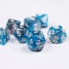 Collection of seven acrylic dice with swirled pearly turquoise and silver colouring and white numbers