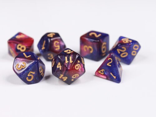 Collection of seven acrylic dice with swirled fine glittery pink and blue colouring and gold numbers