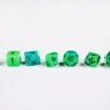 Glowing Wurm Poly-Dice Set containing seven different dice: a D20, D100, D12, D10, D8, D6 and a D4