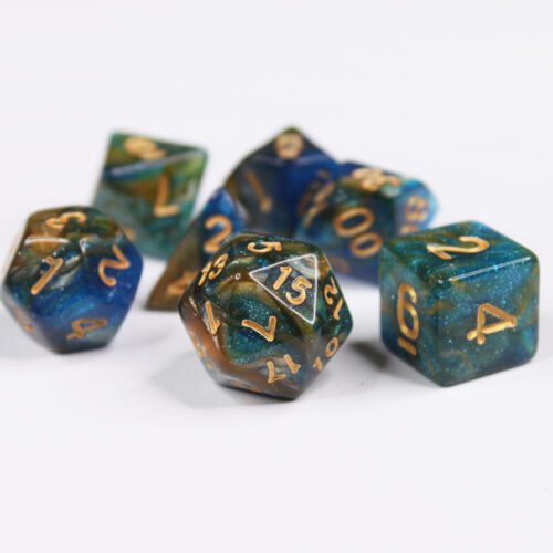 Collection of seven acrylic dice with swirled fine glittery dark blue and gold colouring and gold numbers