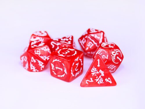 Collection of seven red dice with embossed dragon patterns and white coloured motif and numbering