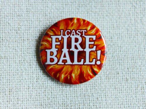 A button badge showing a firey central burst with the text I cast Fire Ball! across it in white