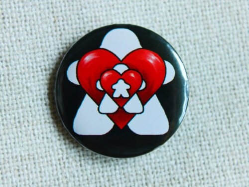 A black button badge whowing repeated images of white meeples and red hearts alternatively getting smaller.