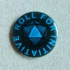 A dark blue button badge with turquoise coloured text reading Roll for Initiative and a centrally an illustrated D20