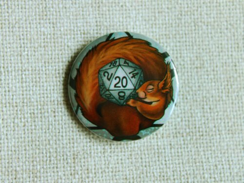 A button badge showing a European red squirrel curled around a grey coloured D20 Die