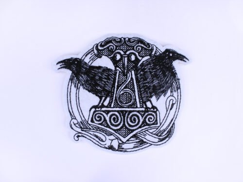 An embroidered patch stitched in a very sketchy manner. It is of the viking symbol Mjollnir flanked by two ravens.