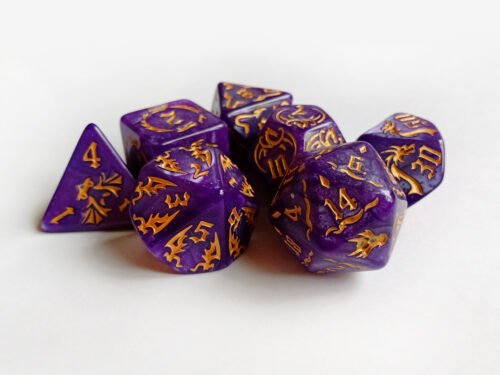 Collection of seven purple dice with embossed dragon patterns and gold coloured motif and numbering.